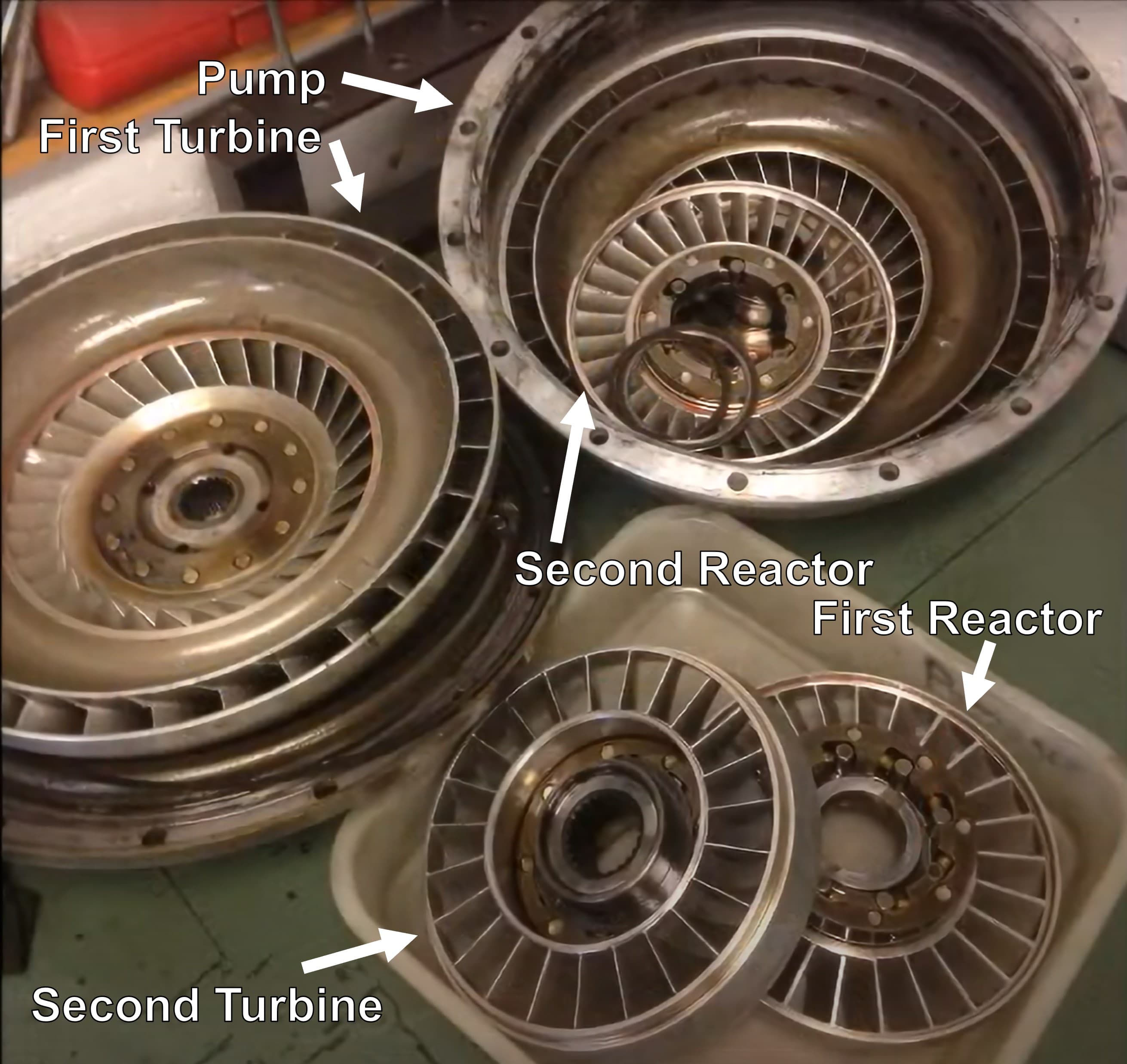 Torque converter being inspected for damage before installation